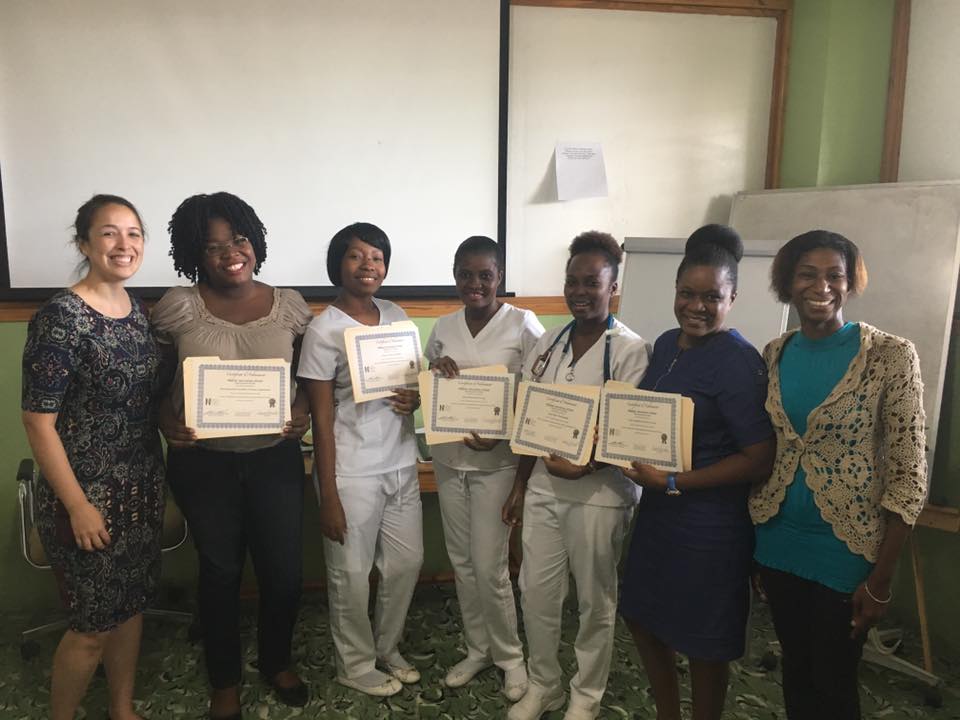 Volunteer nurse supervisor Trisha Groschel, BSN, RN, left, among Haiti Adventist Hospital’s newly certified nursing staff. 