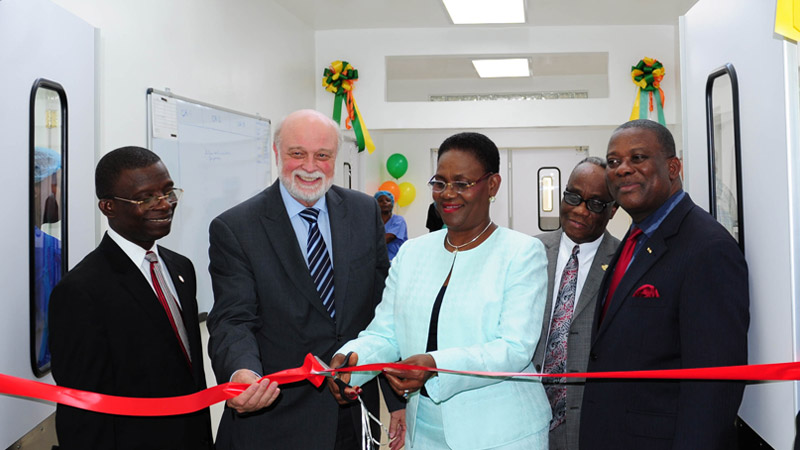 Haiti’s first lady cutting the ribbon at the new surgical suite as Hart, second left, and others watch.