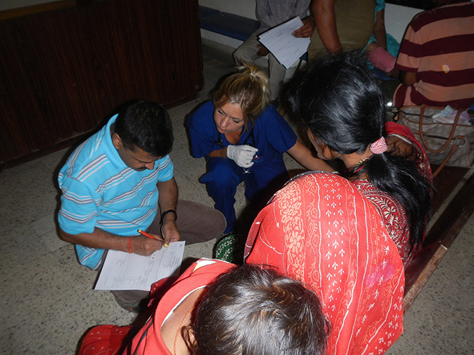 doctor with residents and patient in Nepal