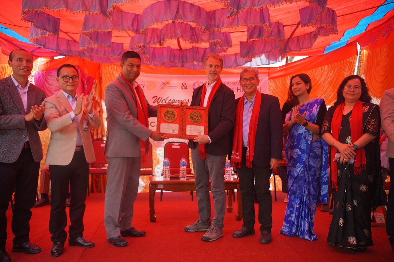 Hon. Kanchan Chandra Bade and SMAH leadership present a plaque of appreciation to Brett Spenst.