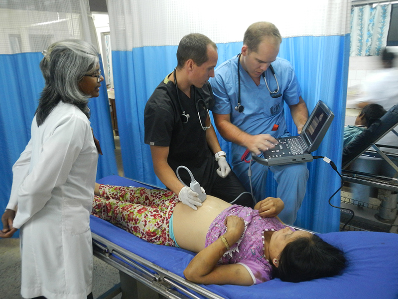 doctor with residents and patient in Nepal