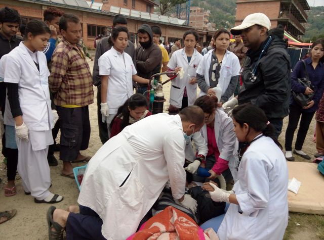 Photo taken the day after the earthquake: Patients wait outside of the hospital for temporary tents to be put up.