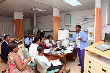 Debbie Nkumba, RN, MSN, CNS, right, instructs a group of nurses at Blantyre Adventist Hospital, Malawi on critical care in 2011.