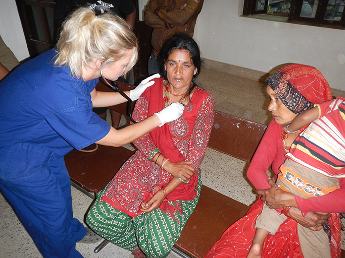 doctor with residents and patient in Nepal
