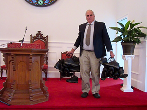 Pastor Greg Carlson with the given shoes