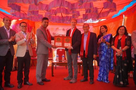 Hon. Kanchan Chandra Bade and SMAH leadership present a plaque of appreciation to Brett Spenst. 