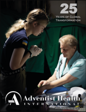 An Angelia Clinic employee praying with a patient   