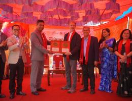 Hon. Kanchan Chandra Bade and SMAH leadership present a plaque of appreciation to Brett Spenst. 