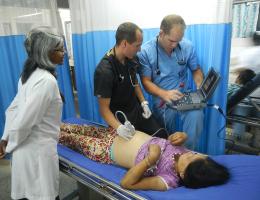 doctor with residents and patient in Nepal