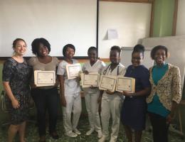 Volunteer nurse supervisor Trisha Groschel, BSN, RN, left, among Haiti Adventist Hospital’s newly certified nursing staff. 